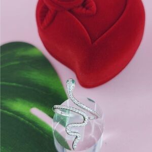 Elegant Silver Snake Ring with Green Accent